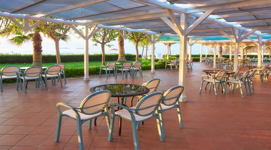 Commercial building with large, colorful awnings providing shade and enhancing the exterior design.