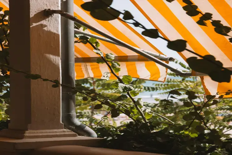 Outdoor orange color line design awnings in Southampton and Hampshire for vibrant shade solutions.